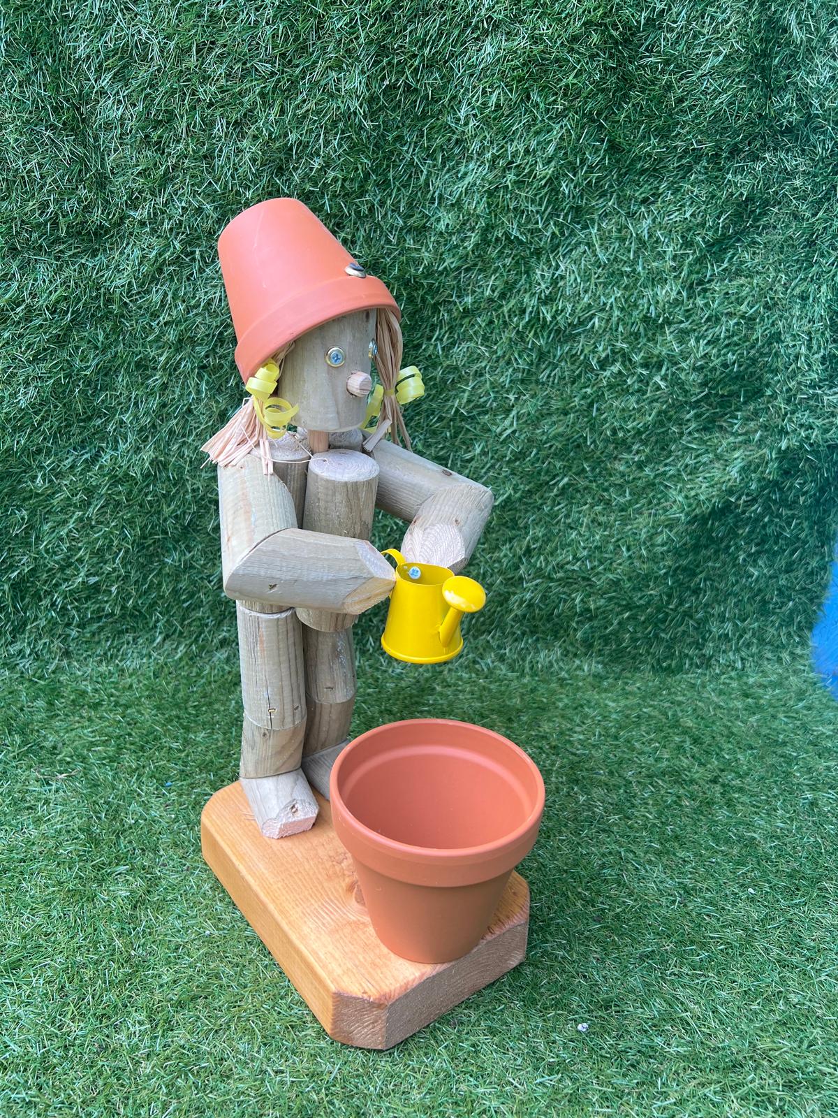 Little Girl or Boy holding a watering can