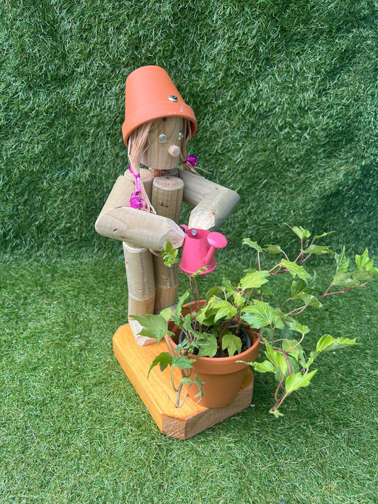 Little Girl or Boy holding a watering can