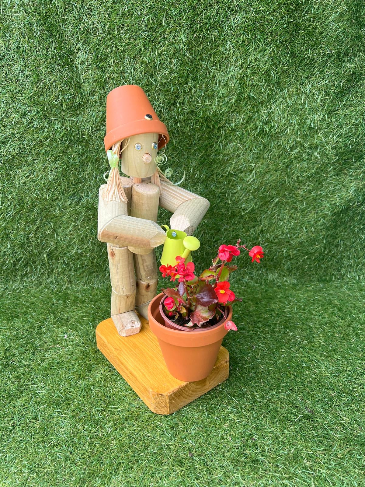 Little Girl or Boy holding a watering can