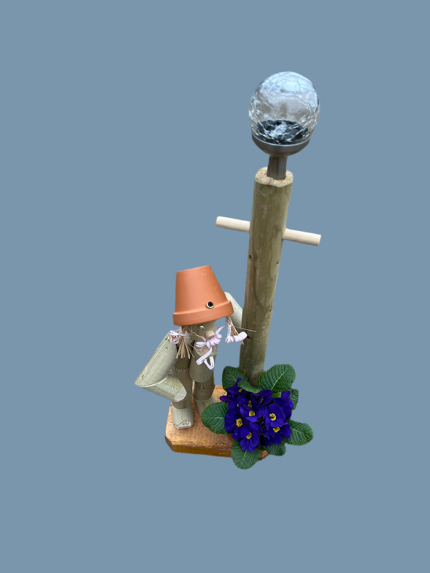 Little girl or boy with a tall lamp post