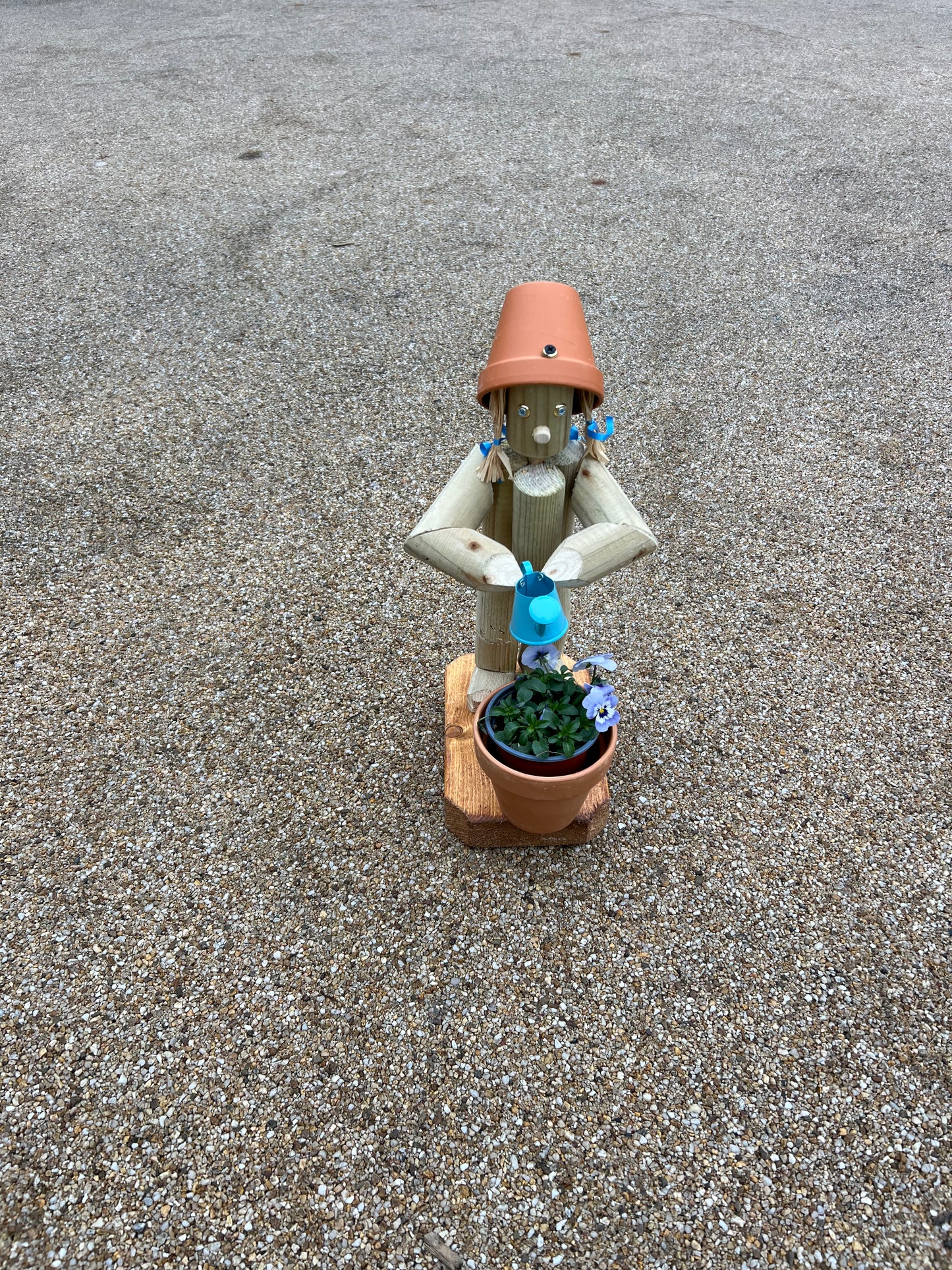 Little Girl or Boy holding a watering can