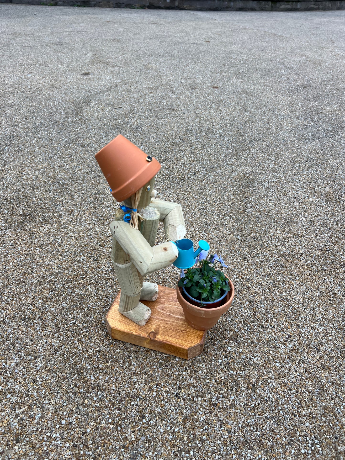 Little Girl or Boy holding a watering can