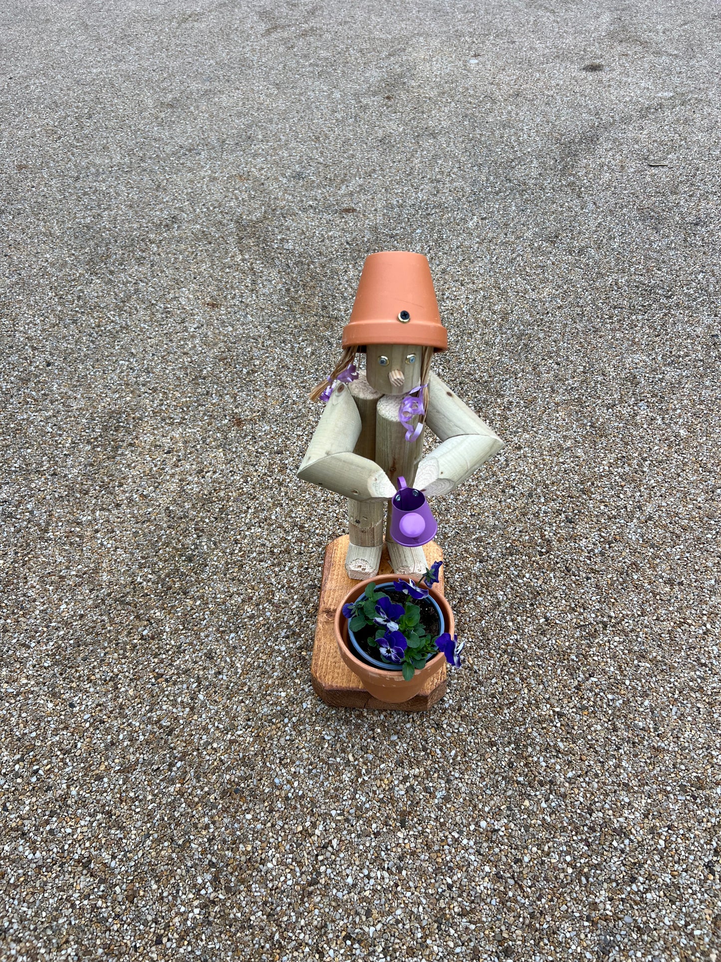 Little Girl or Boy holding a watering can