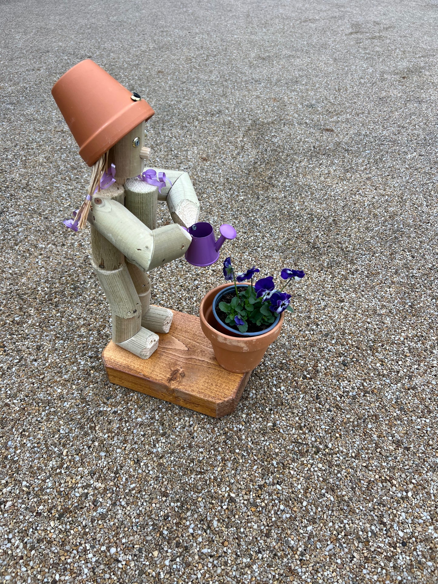 Little Girl or Boy holding a watering can