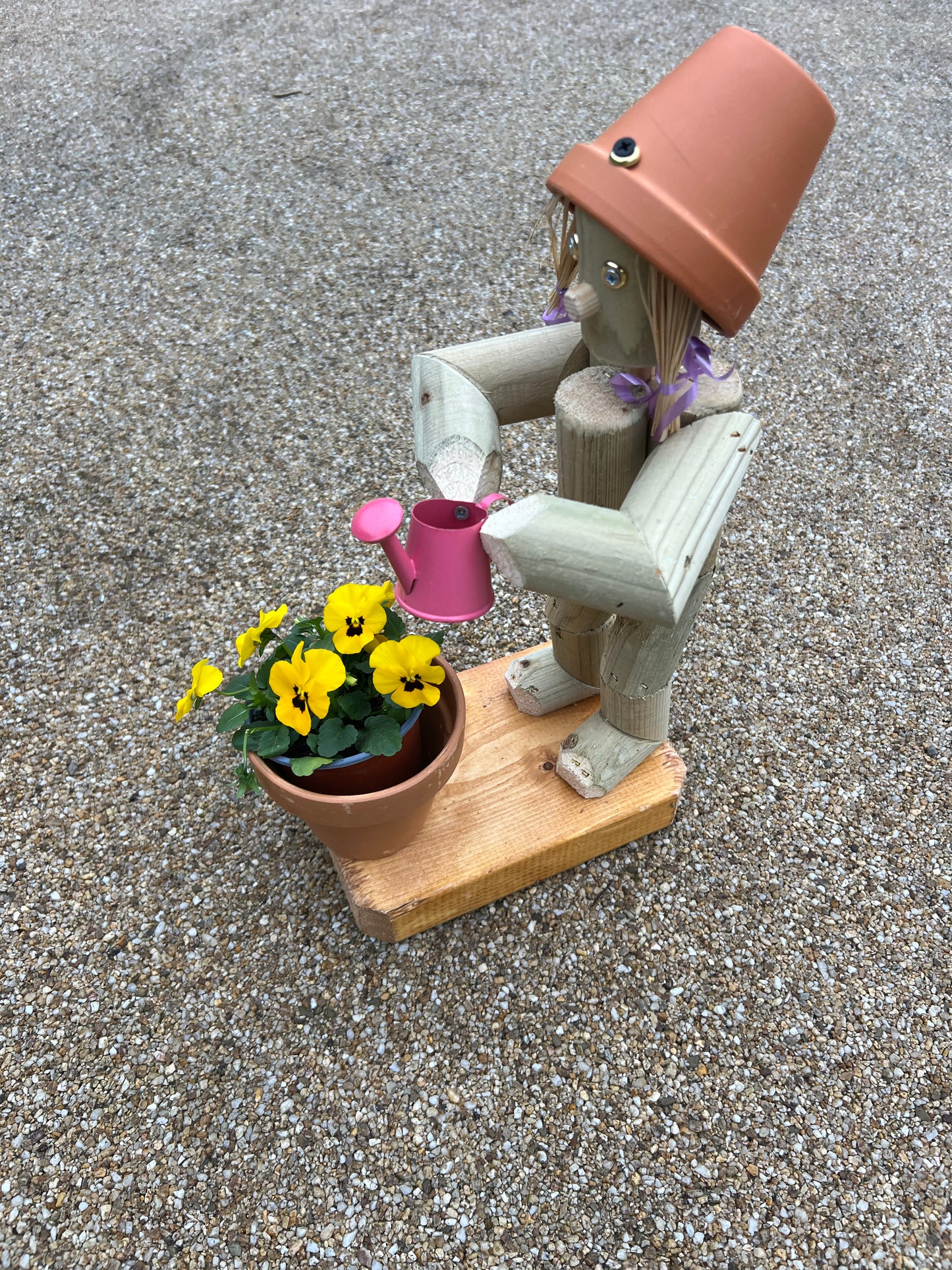 Little Girl or Boy holding a watering can