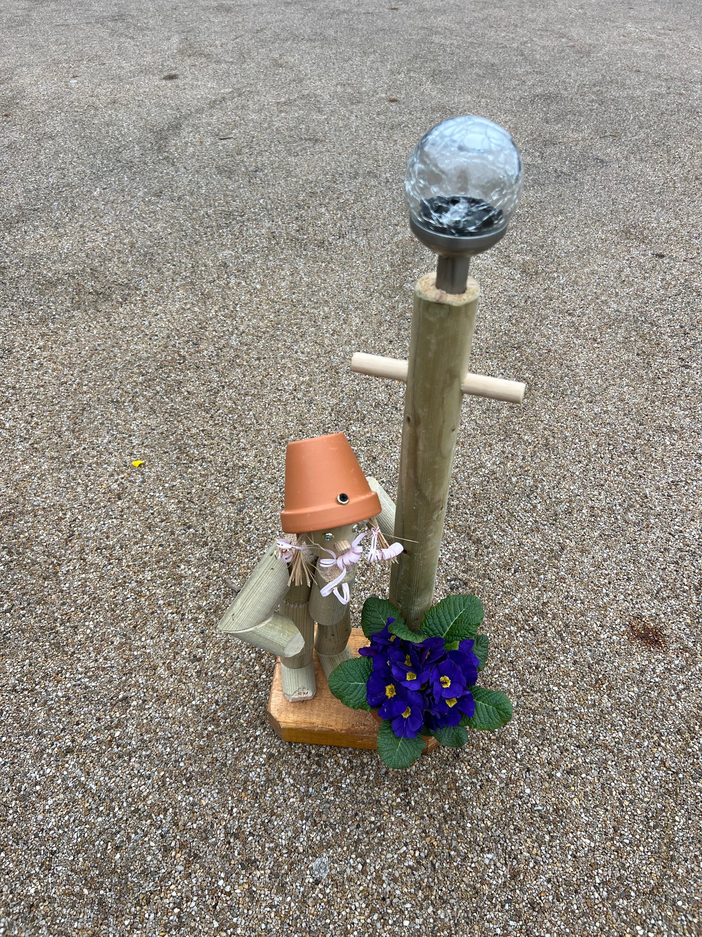 Little girl or boy with a tall lamp post