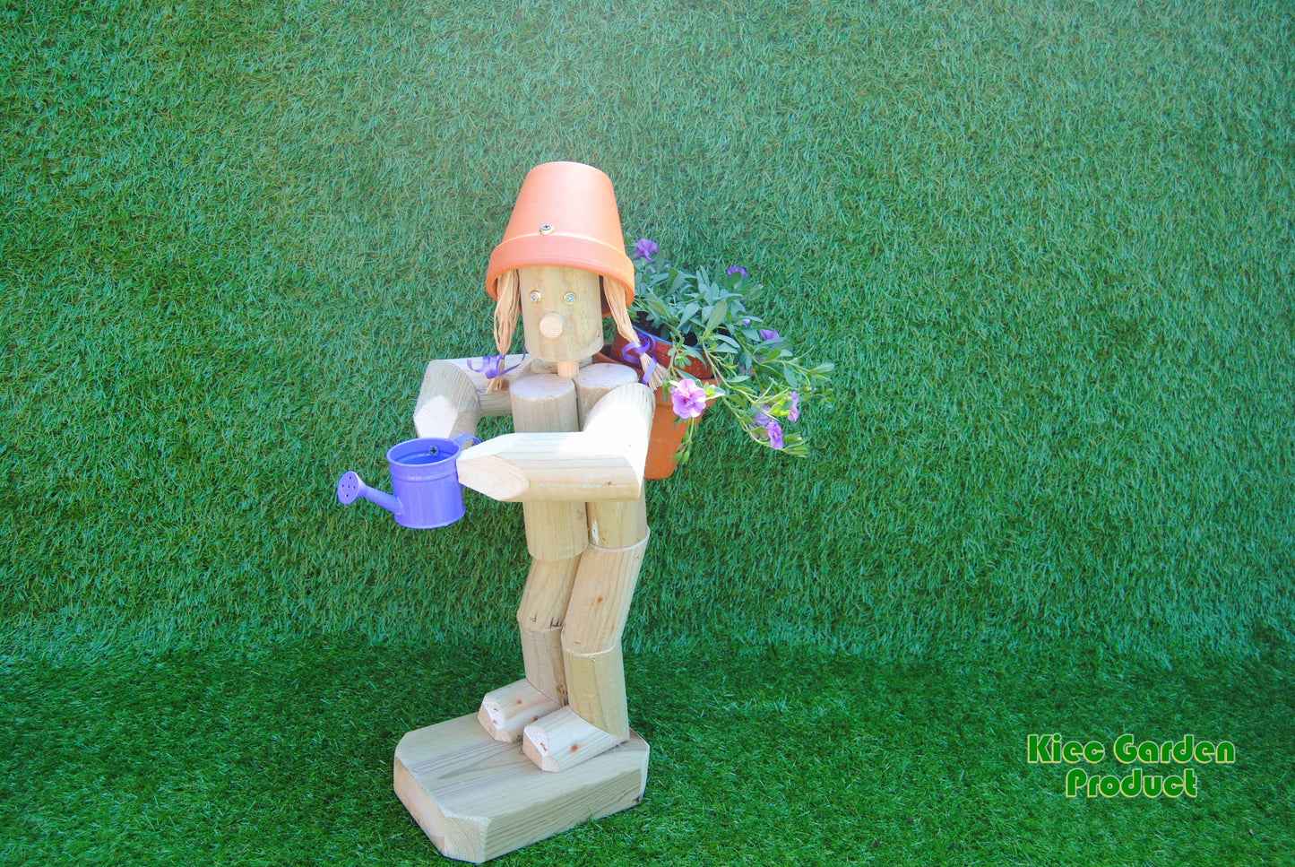 Girl or boy  holding a watering can