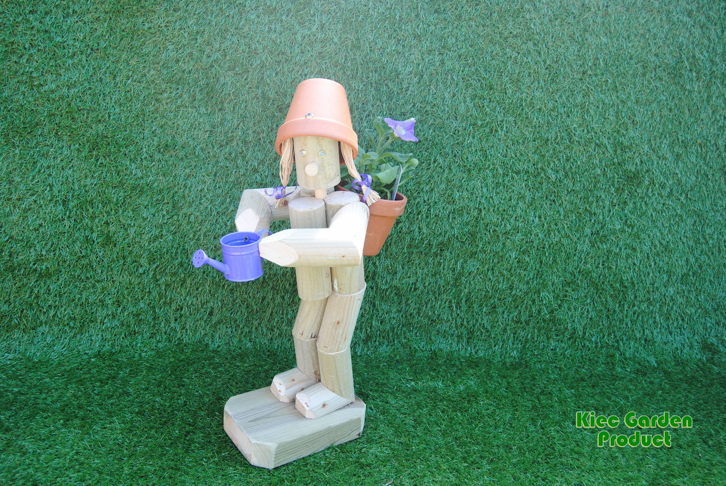 Girl or boy  holding a watering can