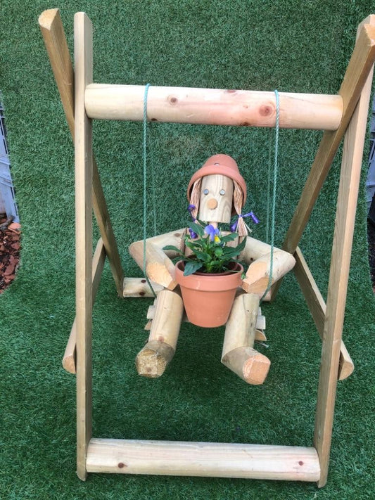 Girl or Boy  sitting on a swing