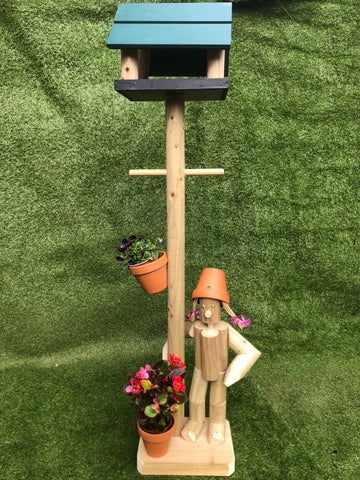 Girl or boy with bird feeder