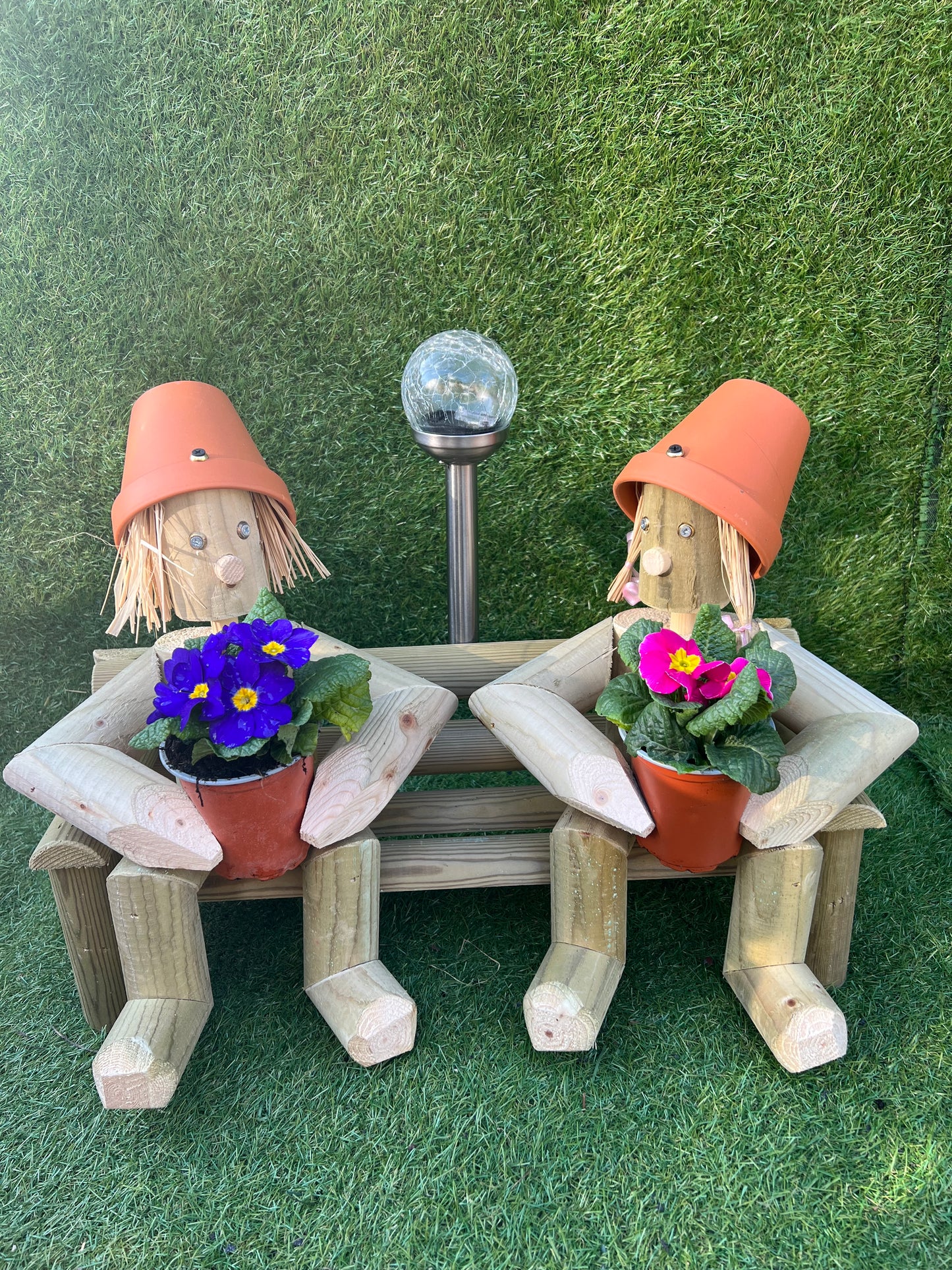 Couple sitting on a bench with solar light