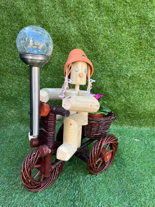 Girl or Boy on a small dark wika bike with solar light