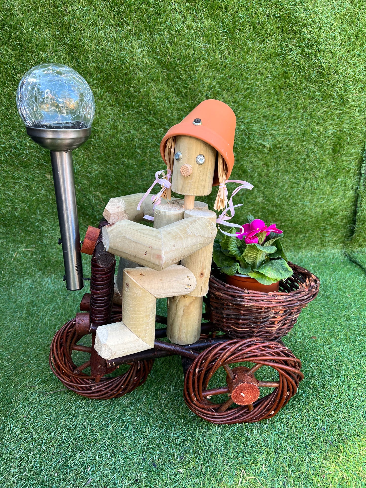 Girl or Boy on a small dark wika bike with solar light