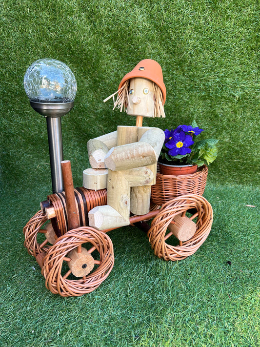 Man on a small bright wika tractor with solar light