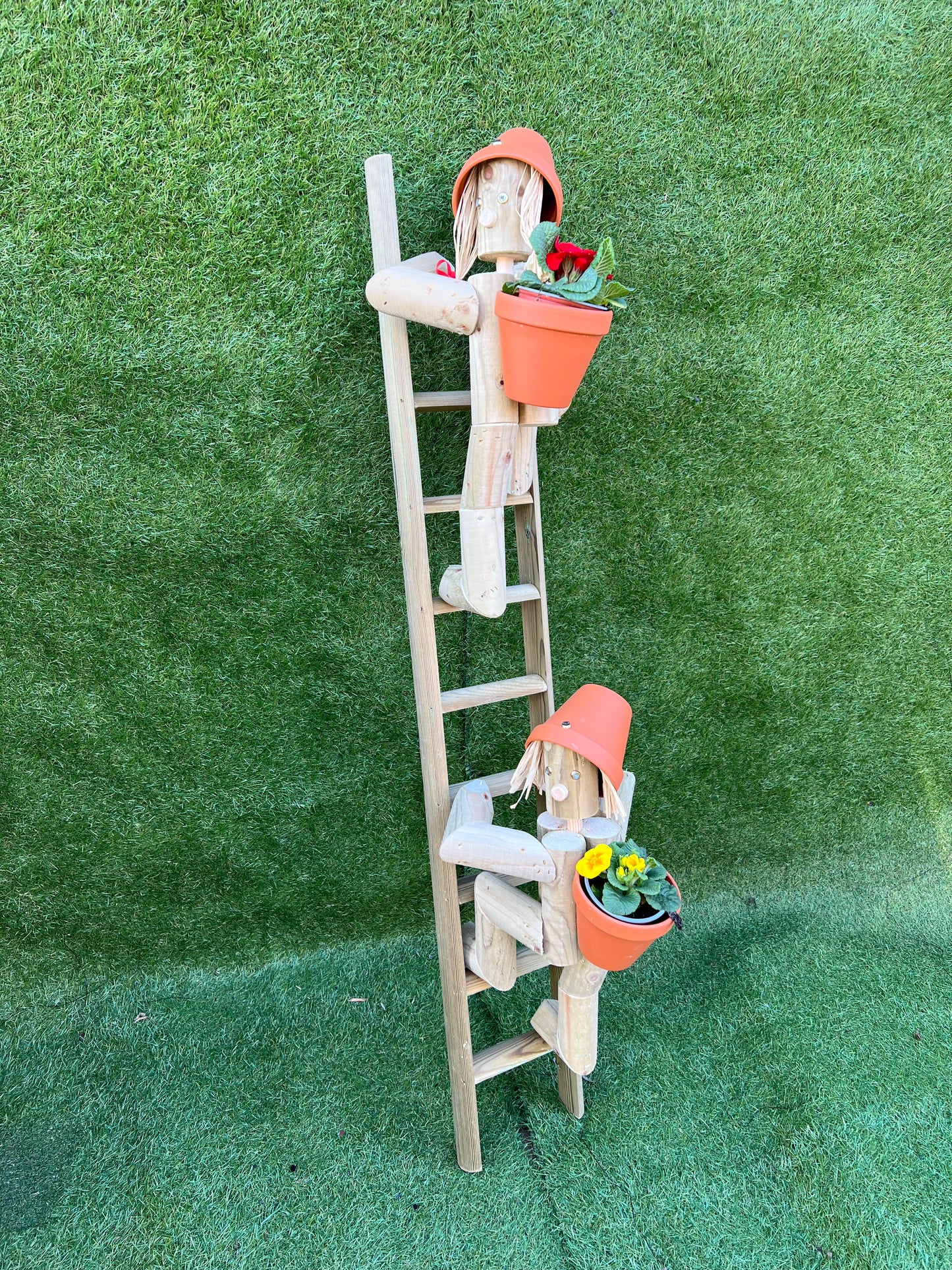 Couple climbing a ladder
