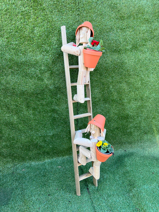 Couple climbing a ladder