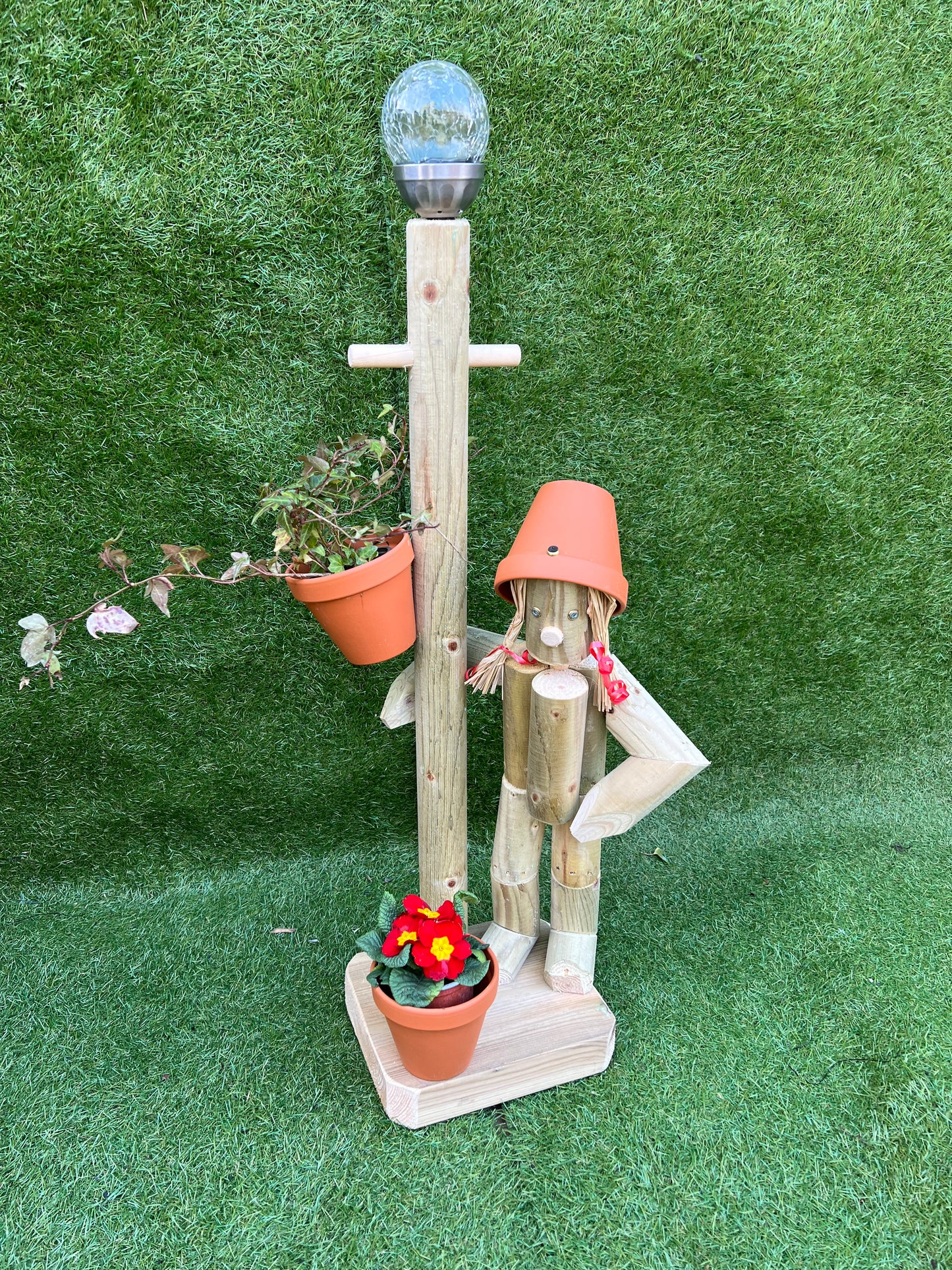 Girl or boy with a tall lamp post