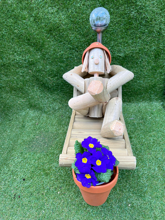 Man on a deckchair with a solar lamp