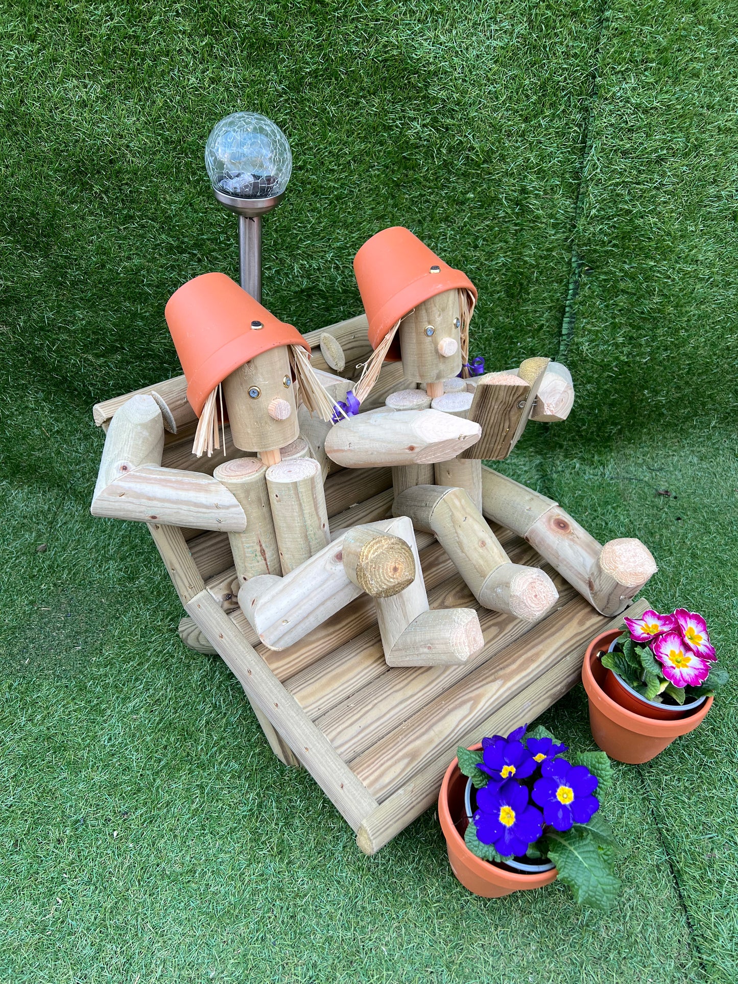 Couple on a deckchair with a solar lamp