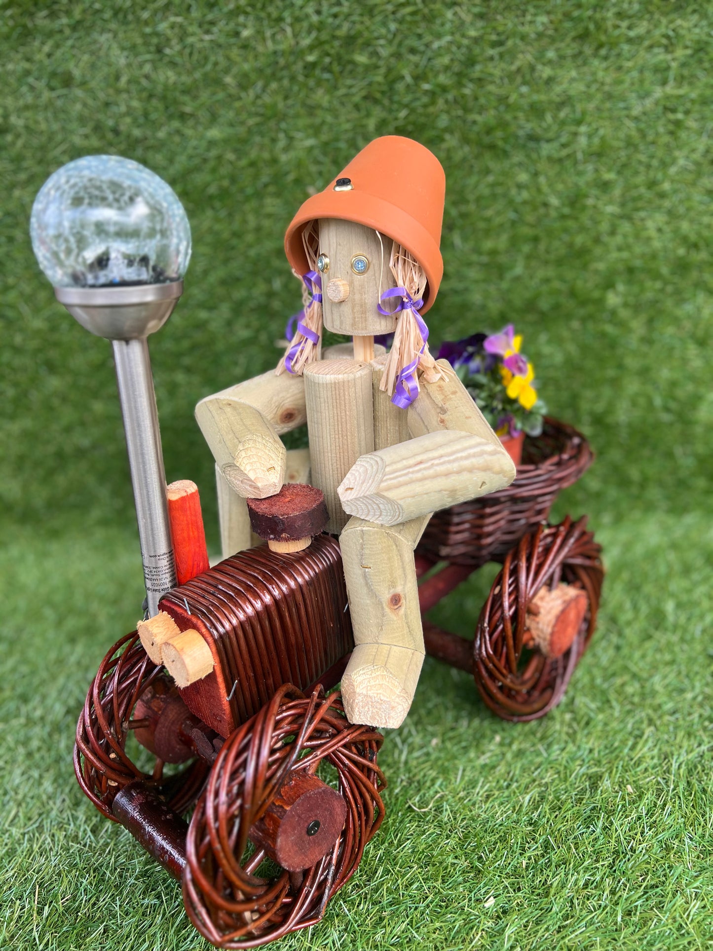 Man on a small dark wika tractor with solar light