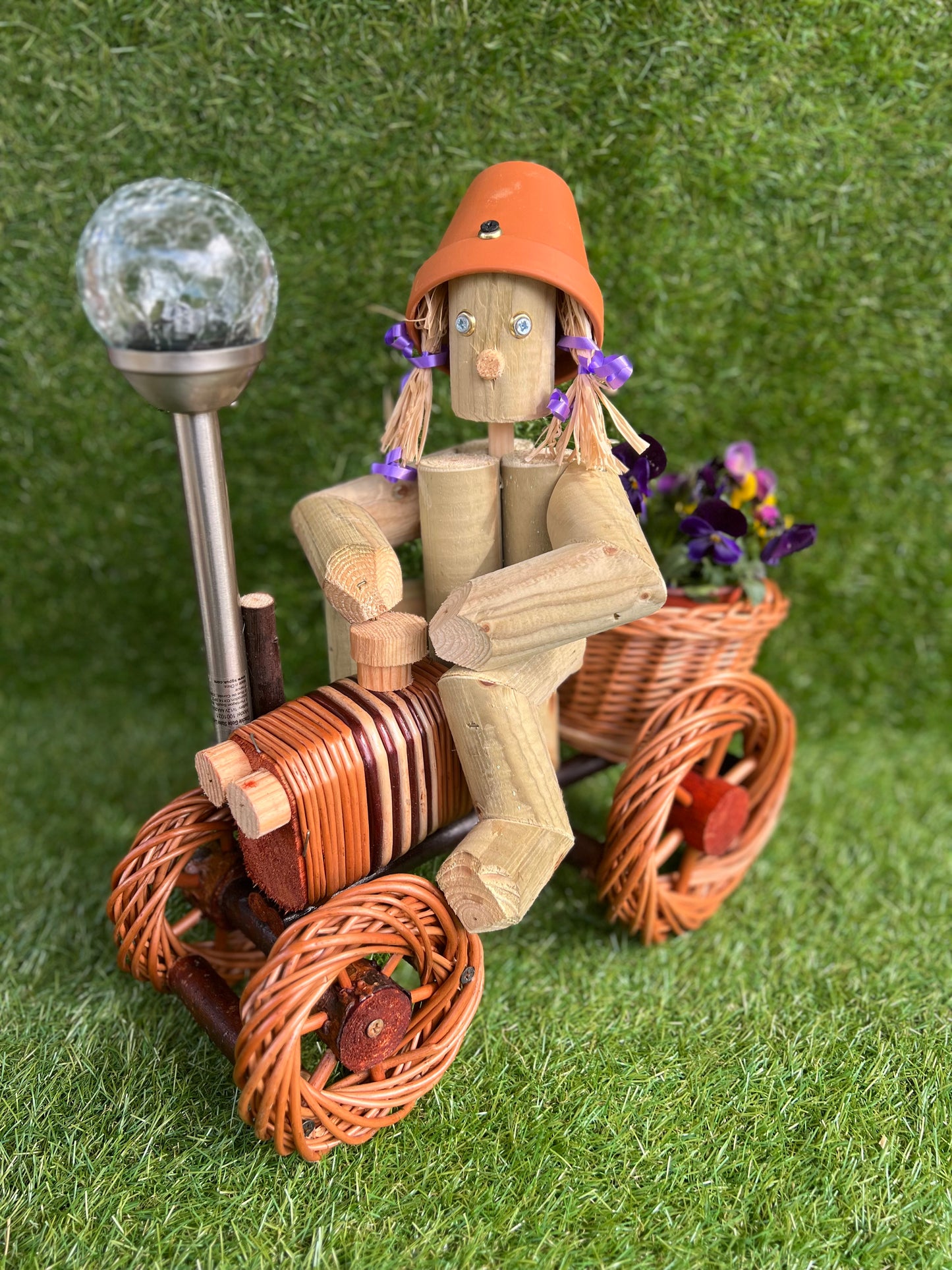 Man on a small bright wika tractor with solar light