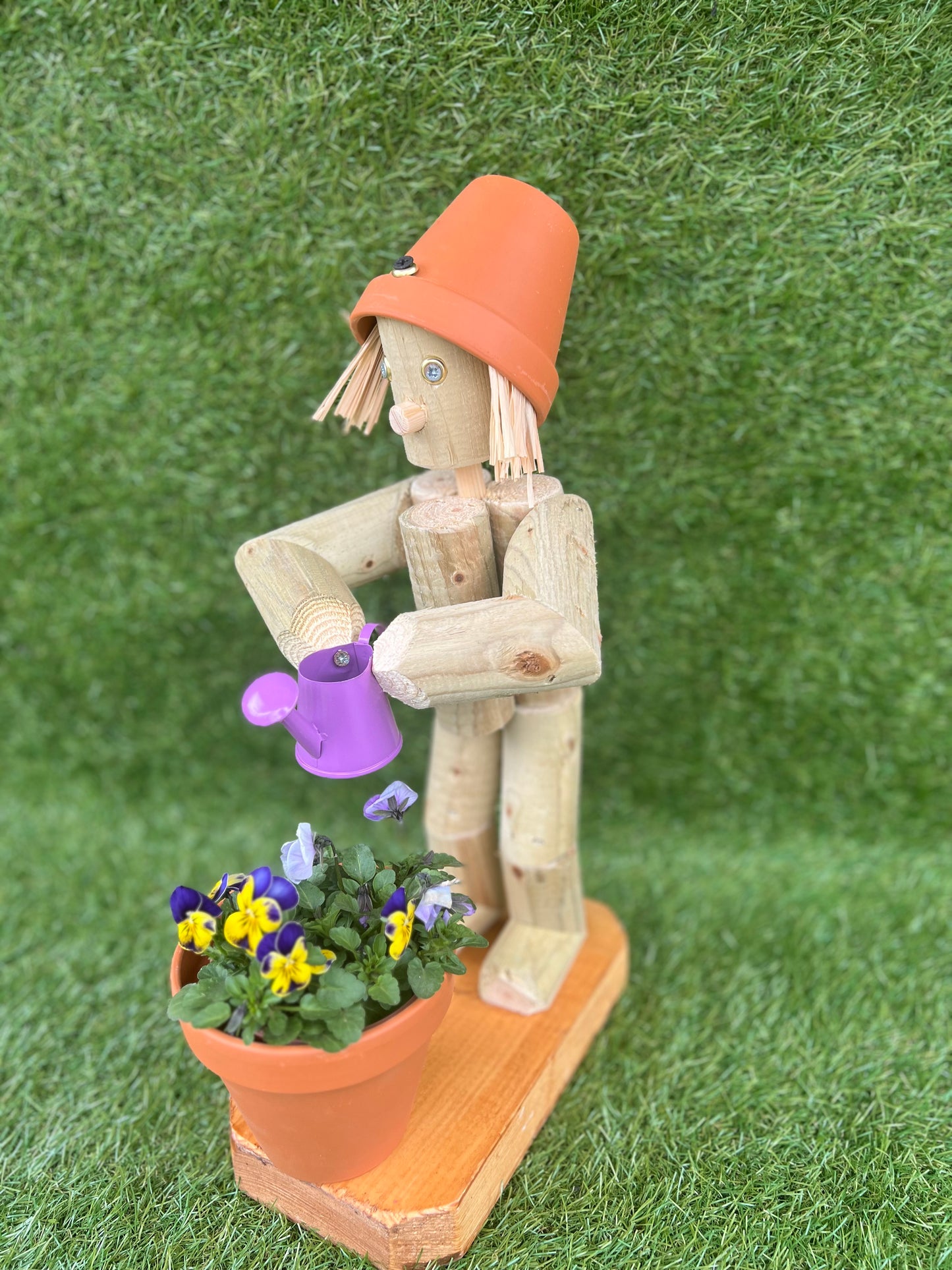 Little Girl or Boy holding a watering can