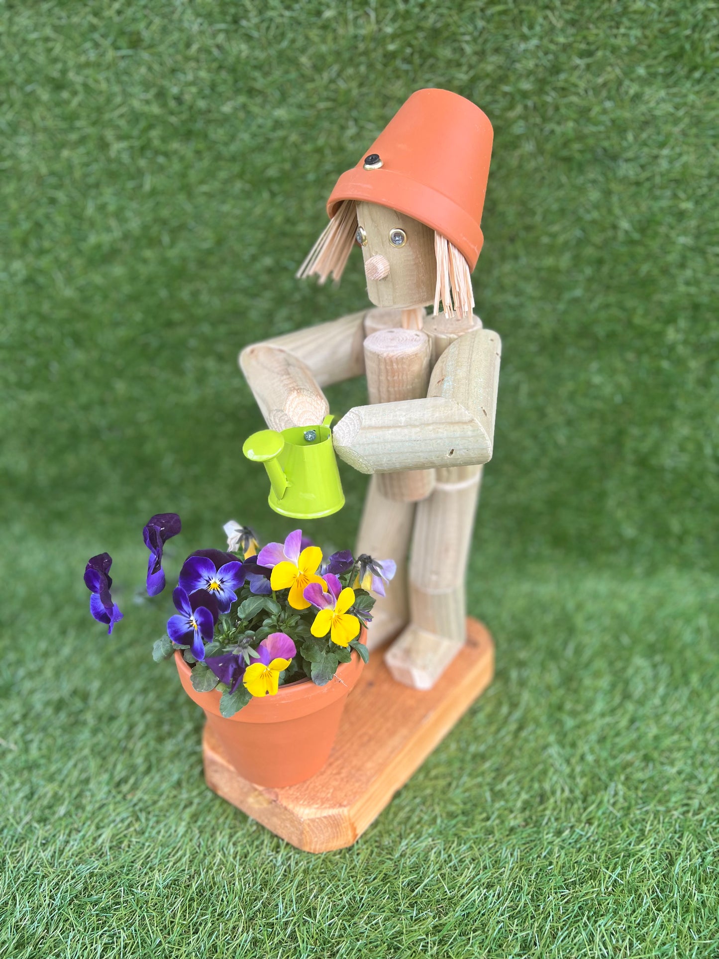 Little Girl or Boy holding a watering can