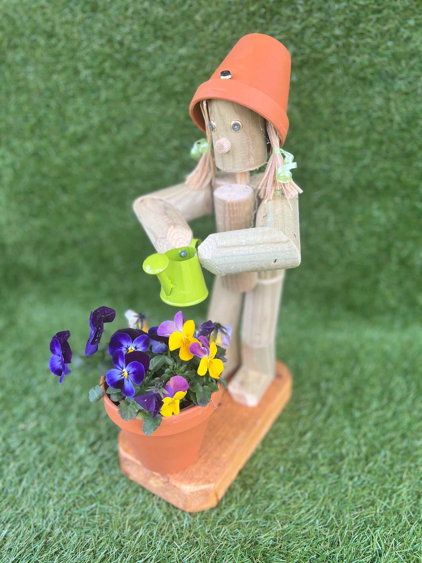 Little Girl or Boy holding a watering can