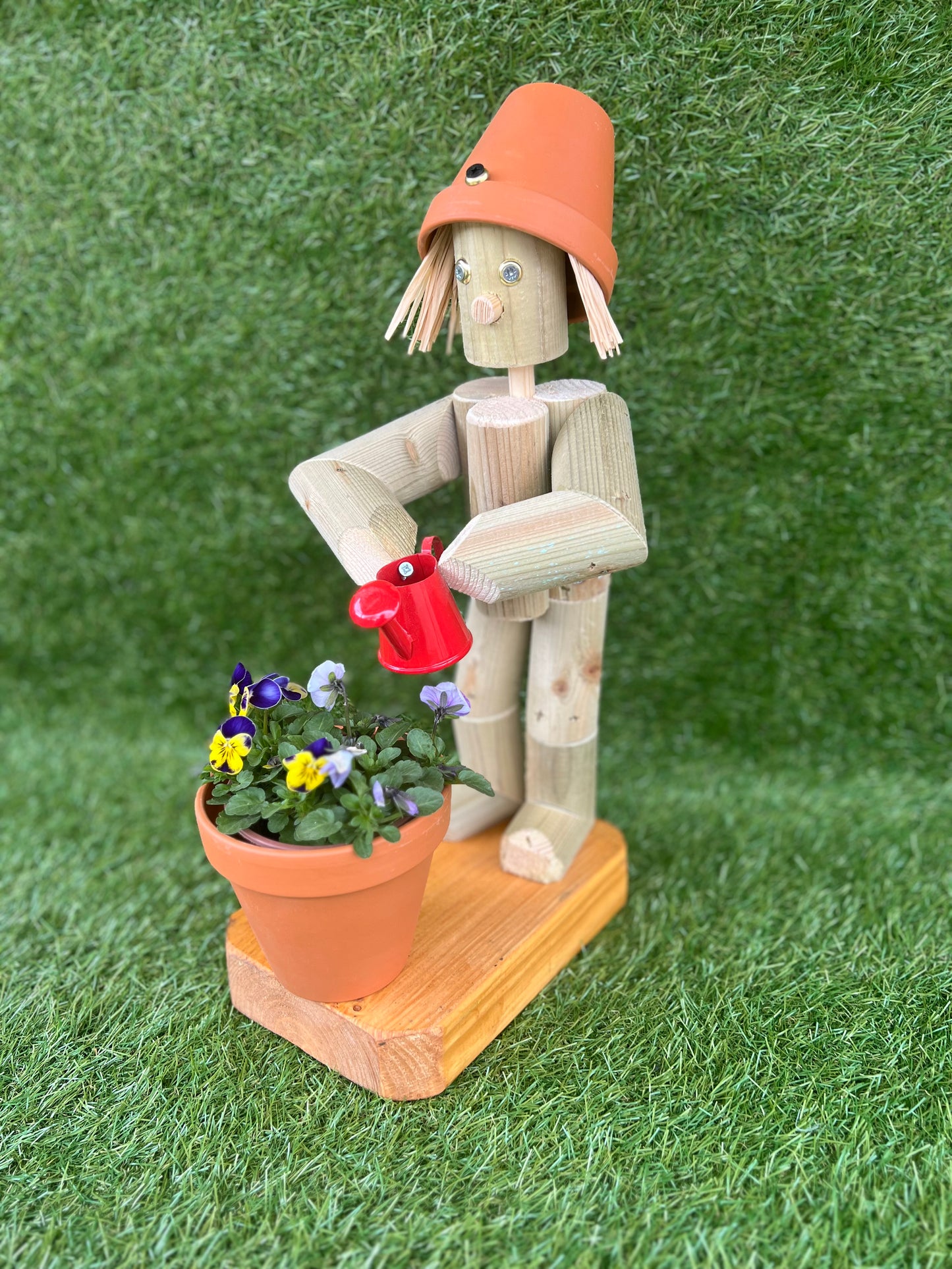Little Girl or Boy holding a watering can