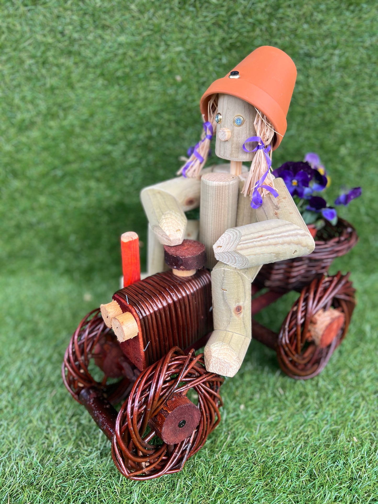 Man on a small dark wika tractor