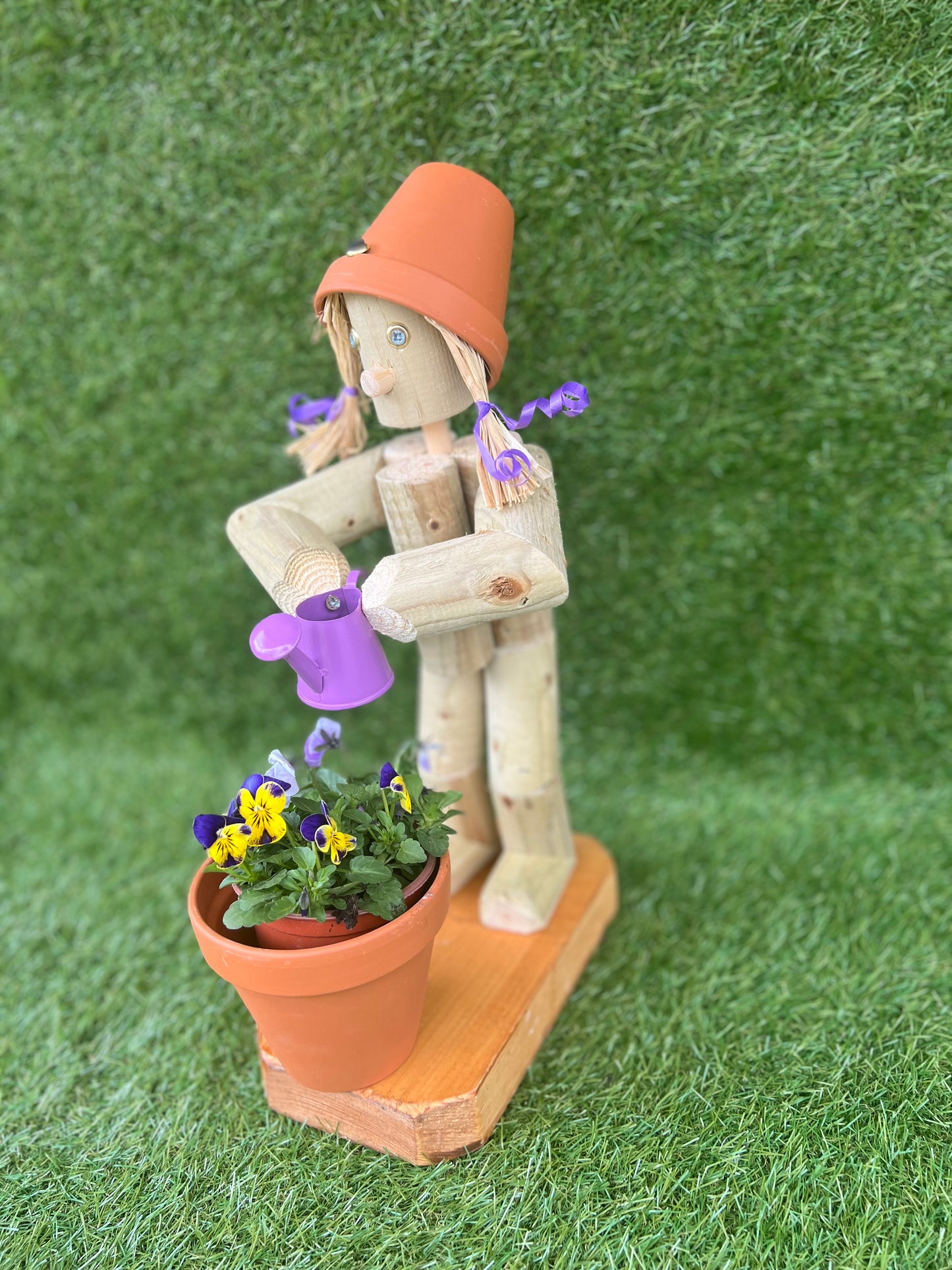 Little Girl or Boy holding a watering can