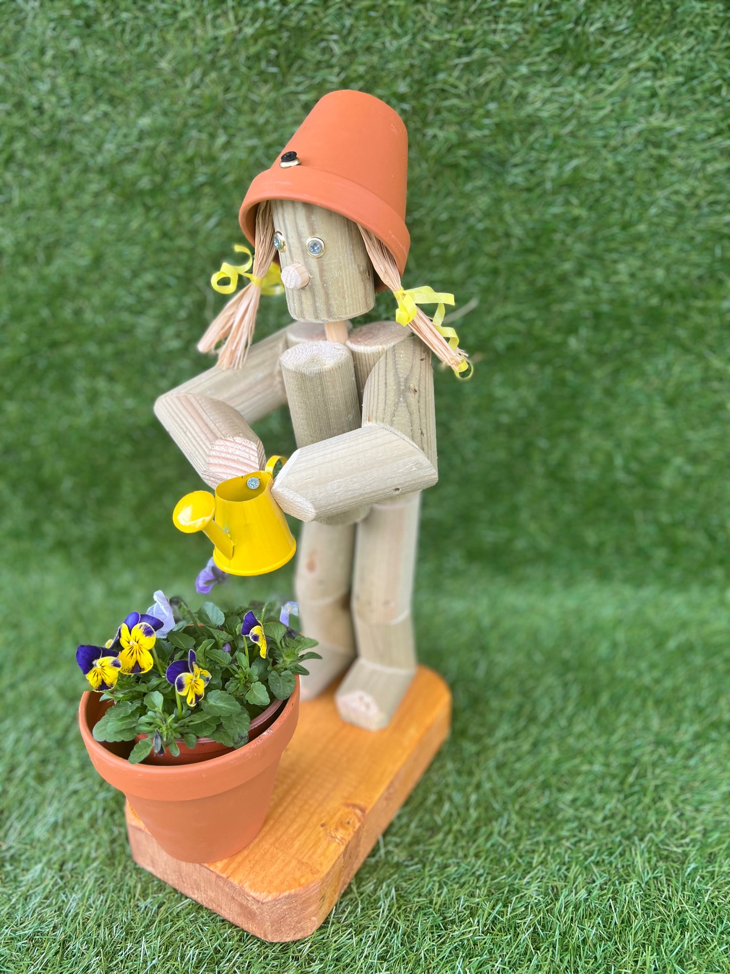 Little Girl or Boy holding a watering can
