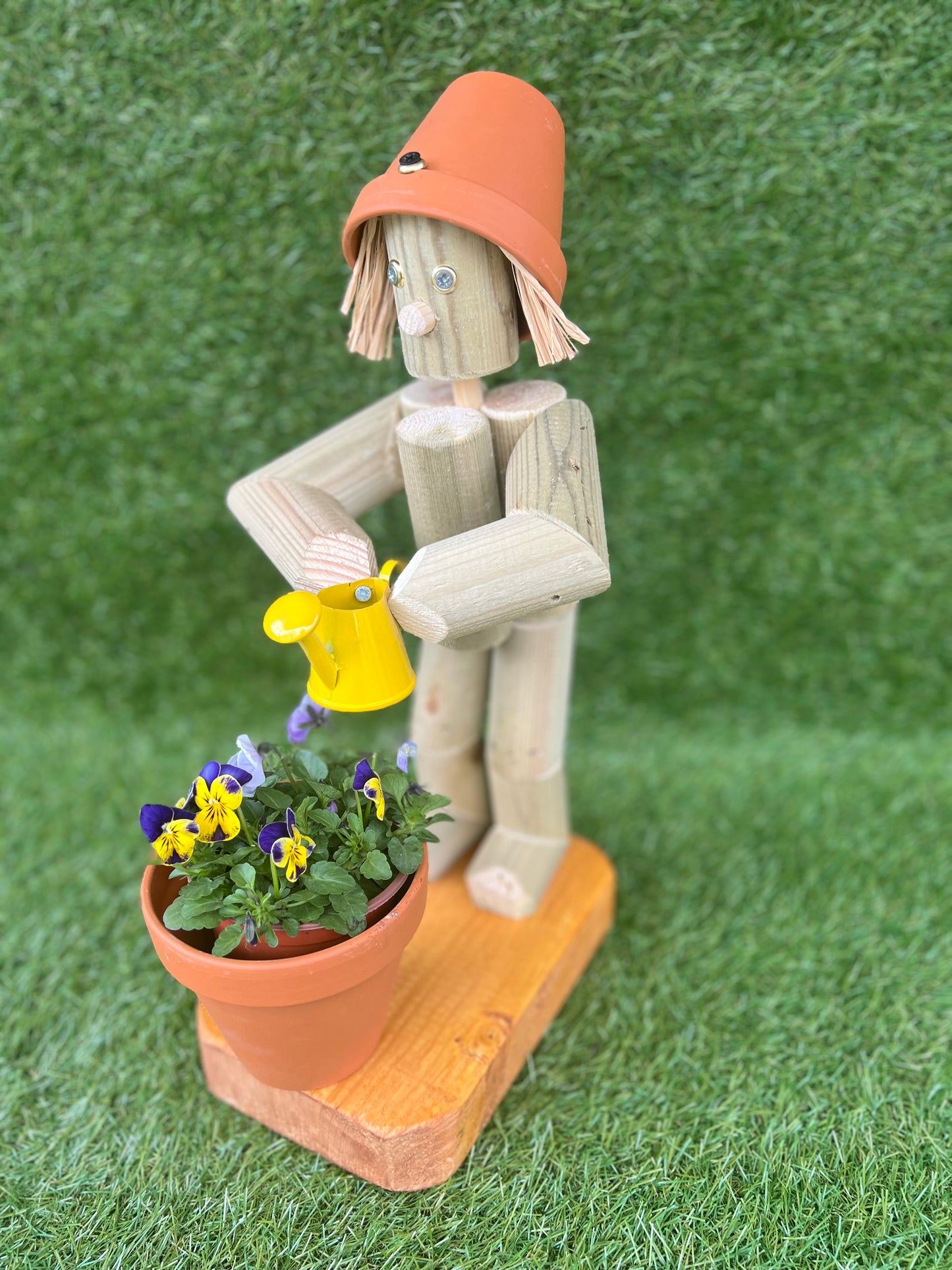 Little Girl or Boy holding a watering can