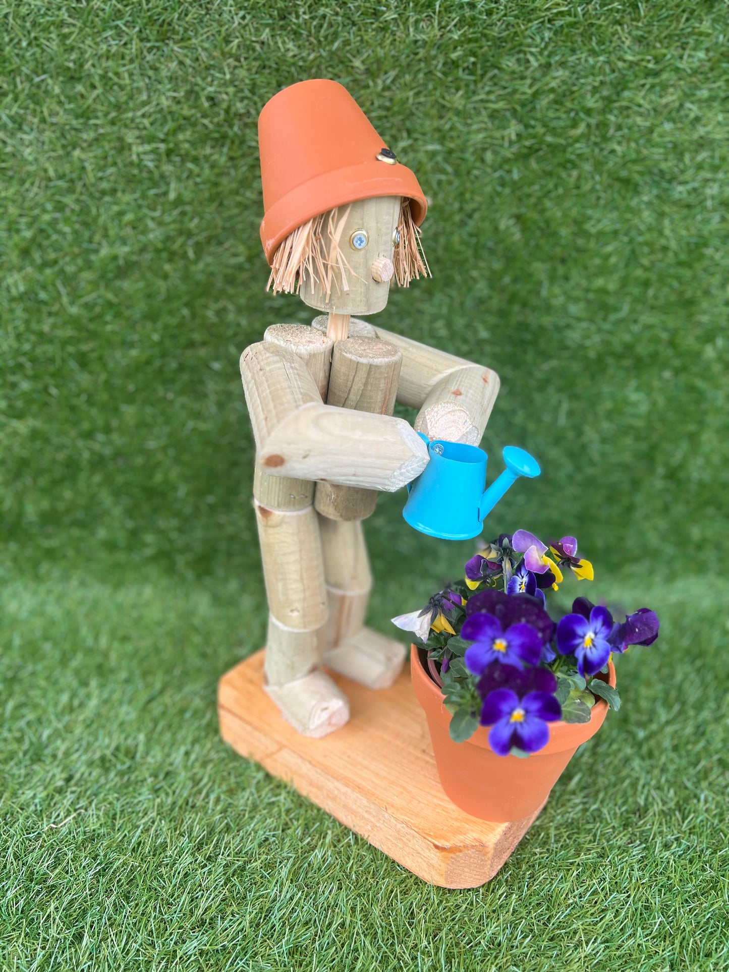 Little Girl or Boy holding a watering can