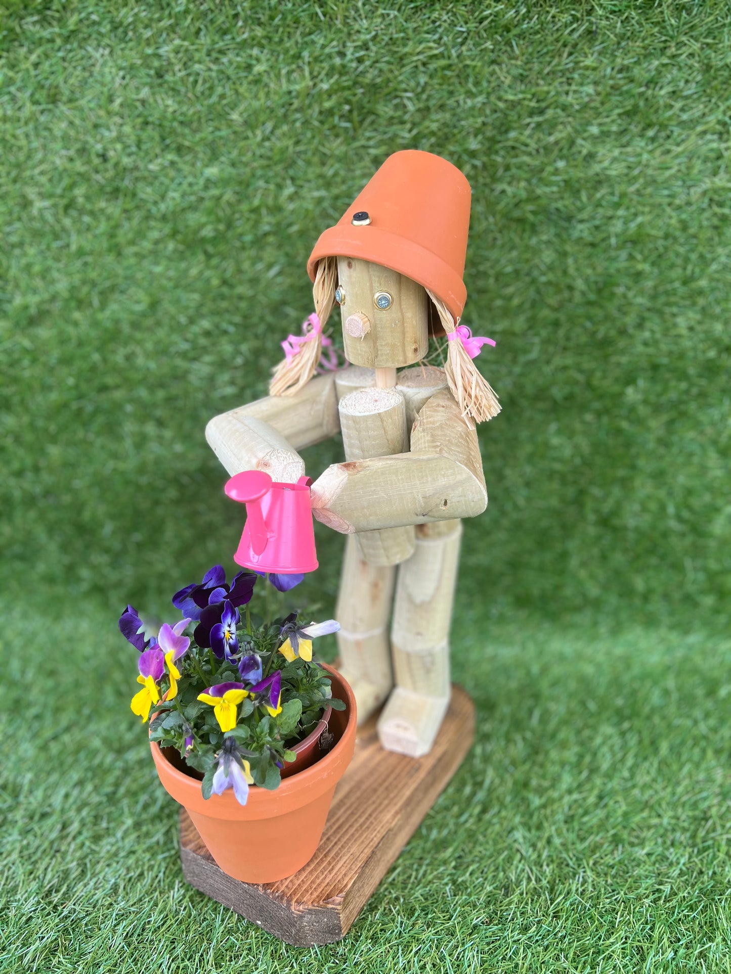 Little Girl or Boy holding a watering can