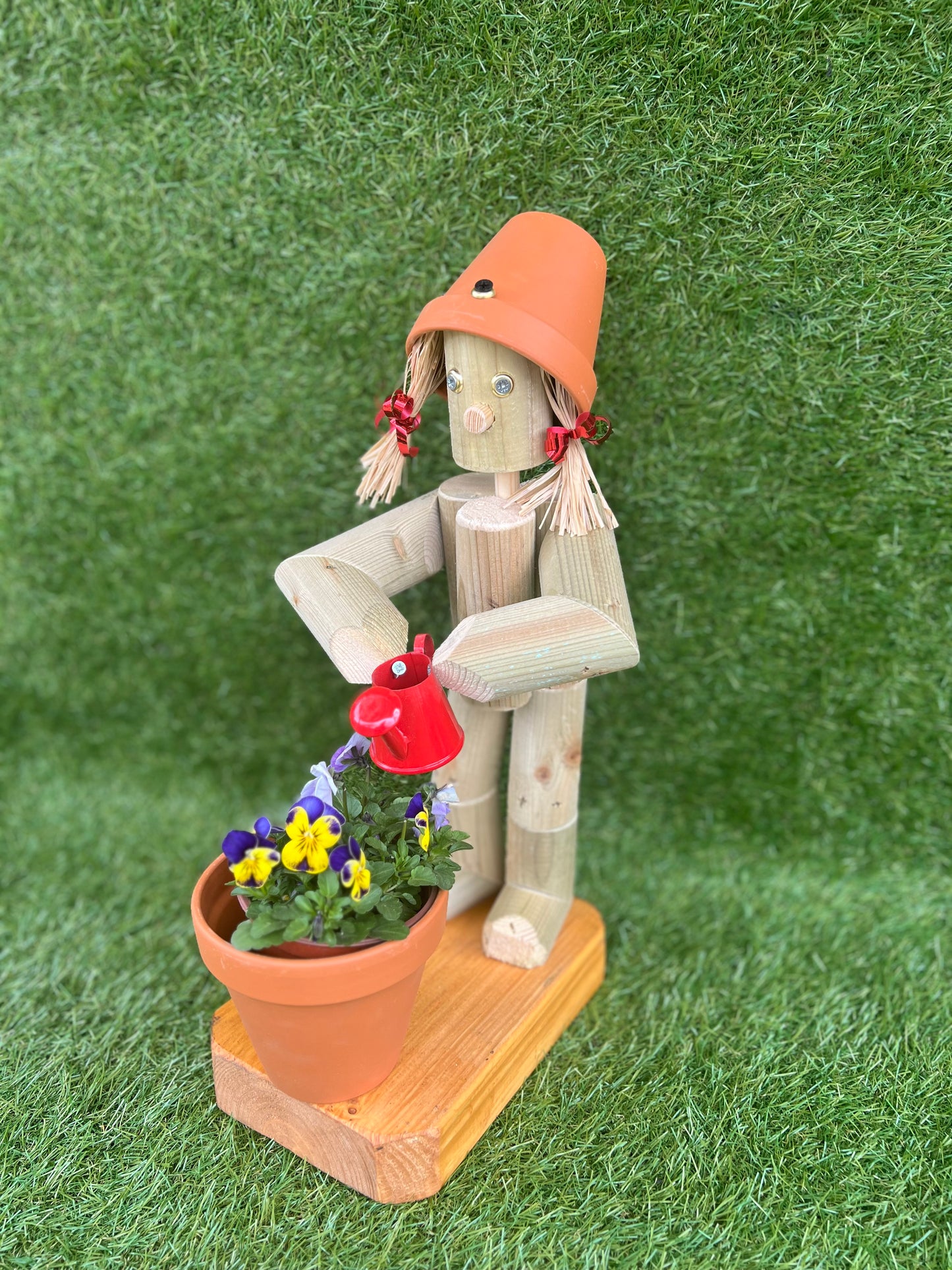 Little Girl or Boy holding a watering can