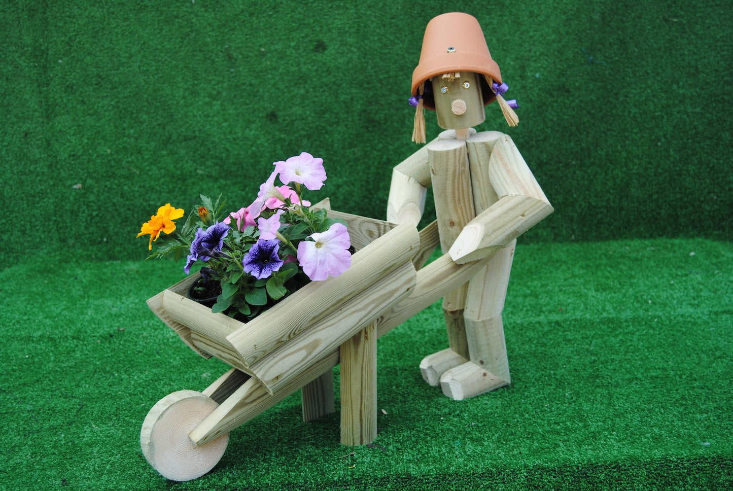 Girl or boy with a wheelbarrow