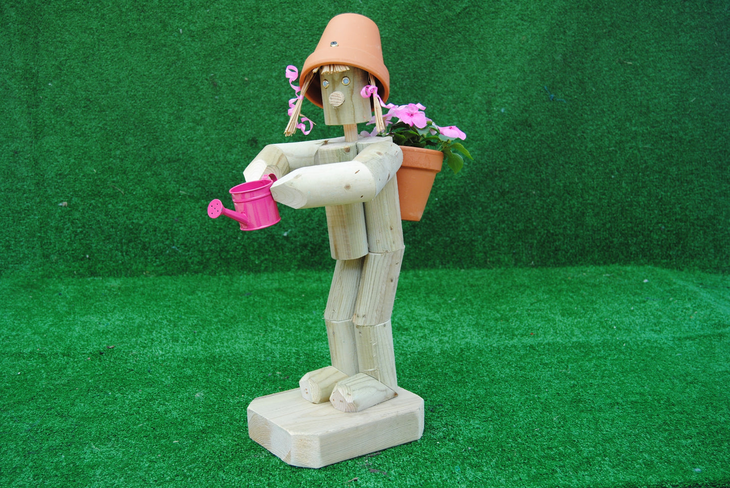 Girl holding a watering can