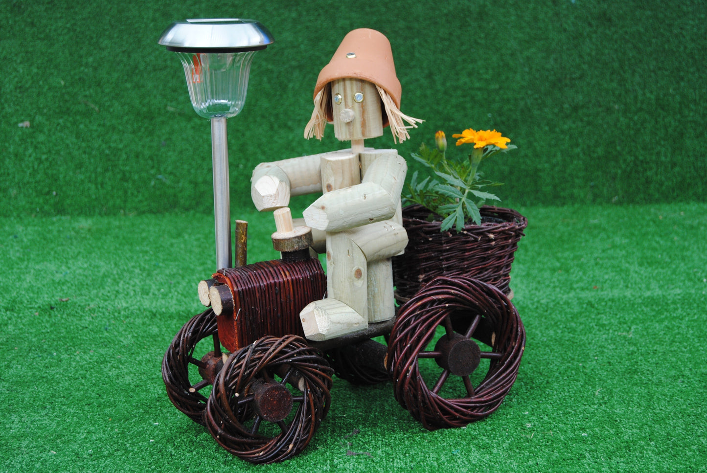 Man on a small dark wika tractor with solar light