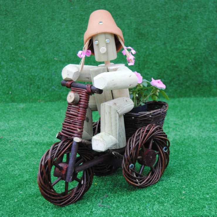 Girl or Boy on a small dark wika bike